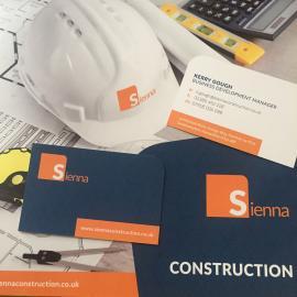 Corporate branding images of literature, business card & hard hat